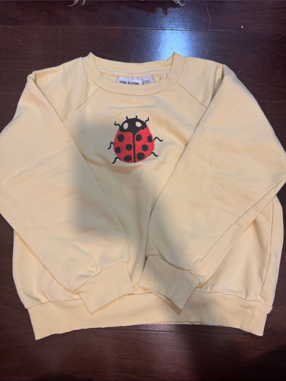 Mini Rodini Yellow Sweatshirt with Red Ladybug Patch